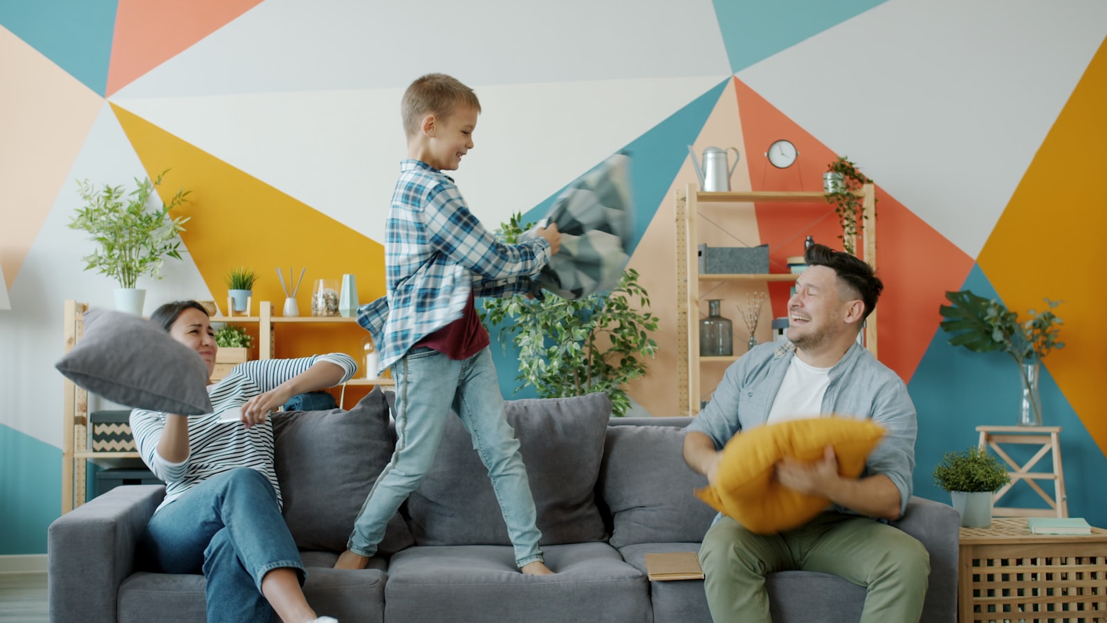 A family talking together on a sofa in a bright living room